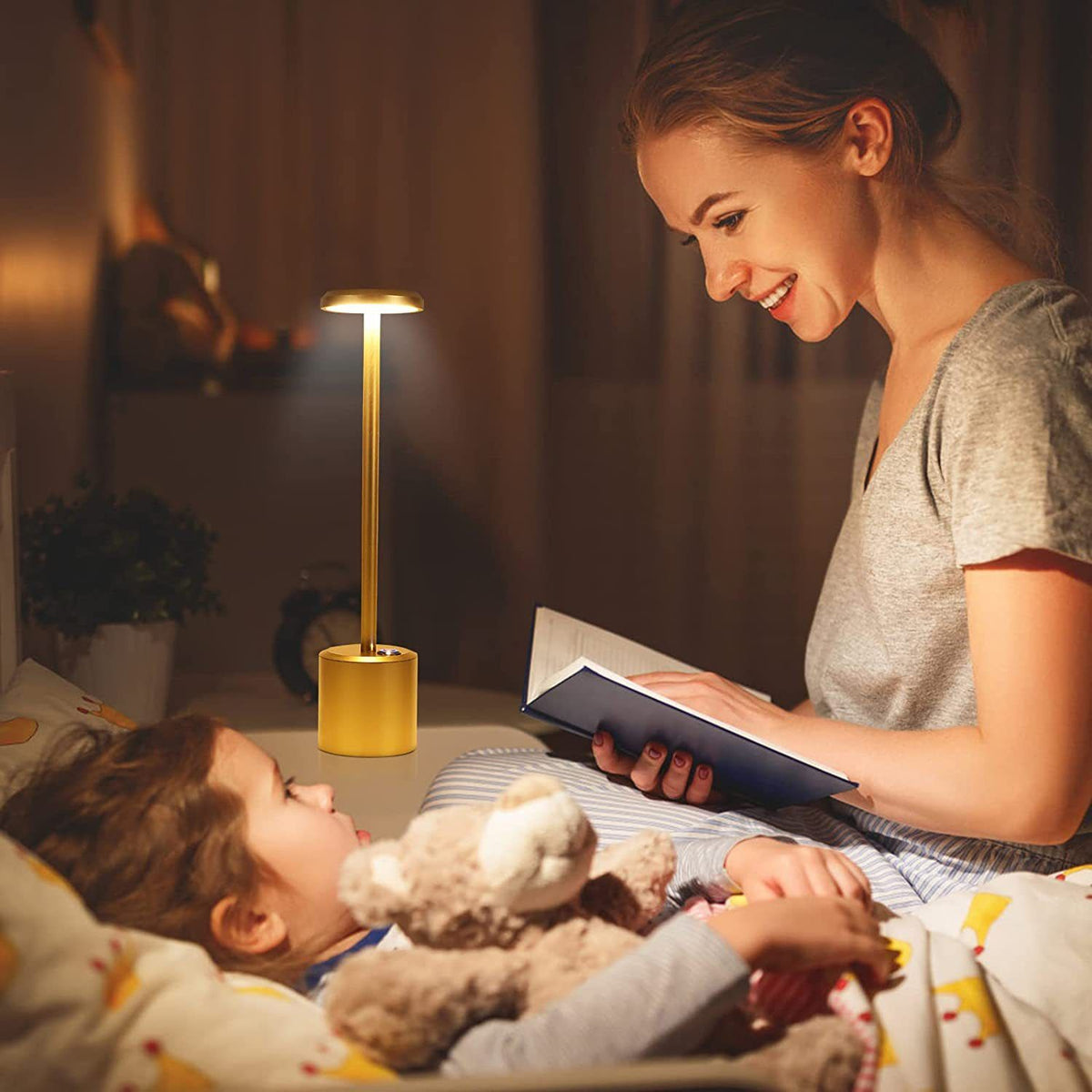 Gold rechargeable cordless LED desk lamp with round head, slim stem and cylindrical base