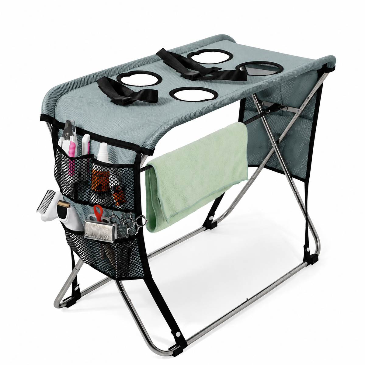 Pink foldable pet grooming table with mesh top, restraint strap and towel bar