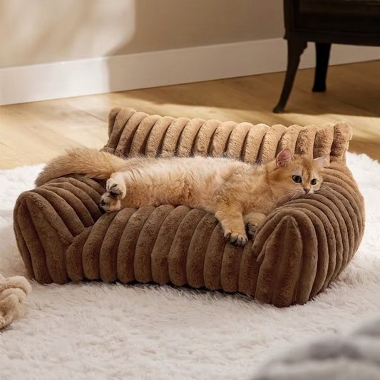Brown faux fur pet sofa bed with raised bolster sides and deep cushion