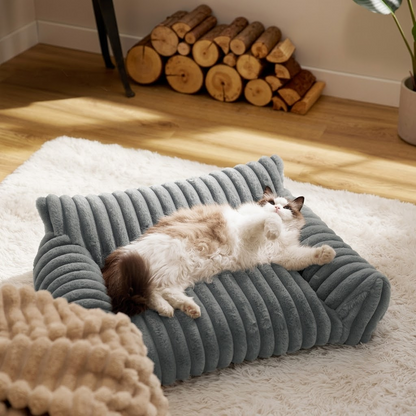 Brown faux fur pet sofa bed with raised bolster sides and deep cushion