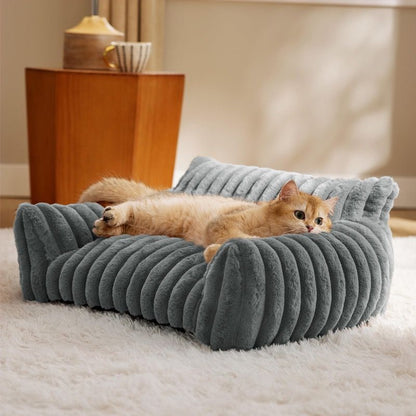 Brown faux fur pet sofa bed with raised bolster sides and deep cushion