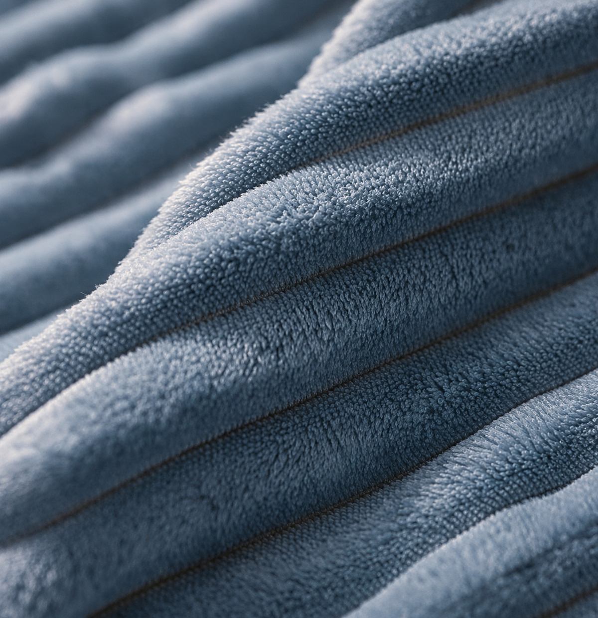 Blue soft pet sleeping mat with ribbed surface and waterproof non-slip base