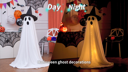 Tall standing white Halloween ghost decorations lit from within on a porch
