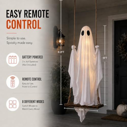 White fabric Halloween ghost hanging from a porch and lit from within