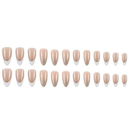 Set of nude pink press-on nails with glossy finish and glitter tip designs