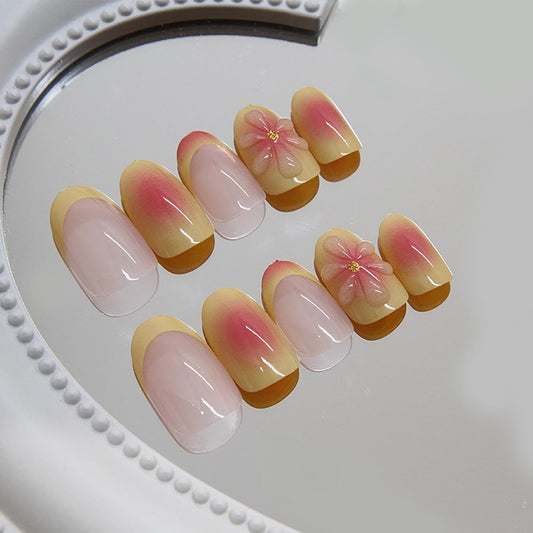 Light pink press-on nails with gradient finish and 3D flower accents