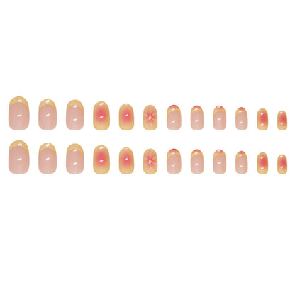 Light pink press-on nails with gradient finish and 3D flower accents