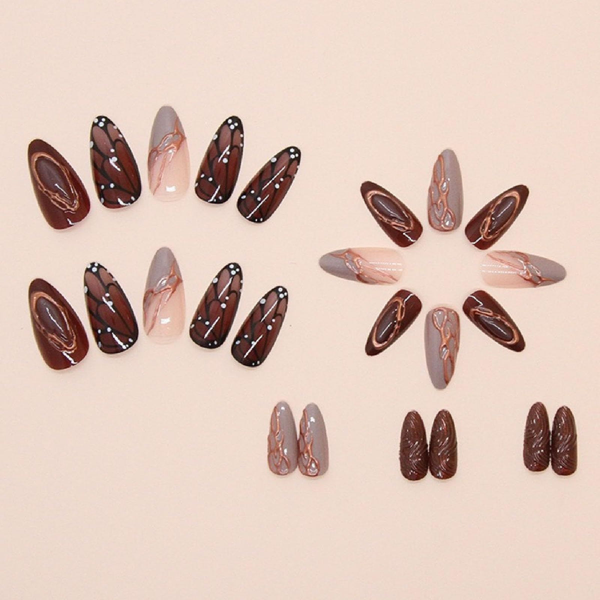 Brown medium almond press-on nails with butterfly wing designs and chrome accents