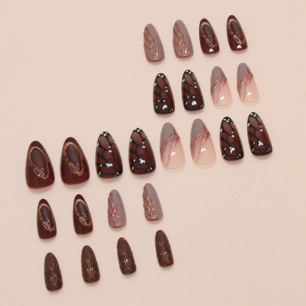 Brown medium almond press-on nails with butterfly wing designs and chrome accents