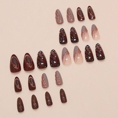 Brown medium almond press-on nails with butterfly wing designs and chrome accents