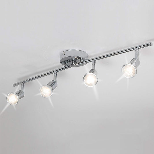 Chrome four head LED track lighting bar mounted on a ceiling