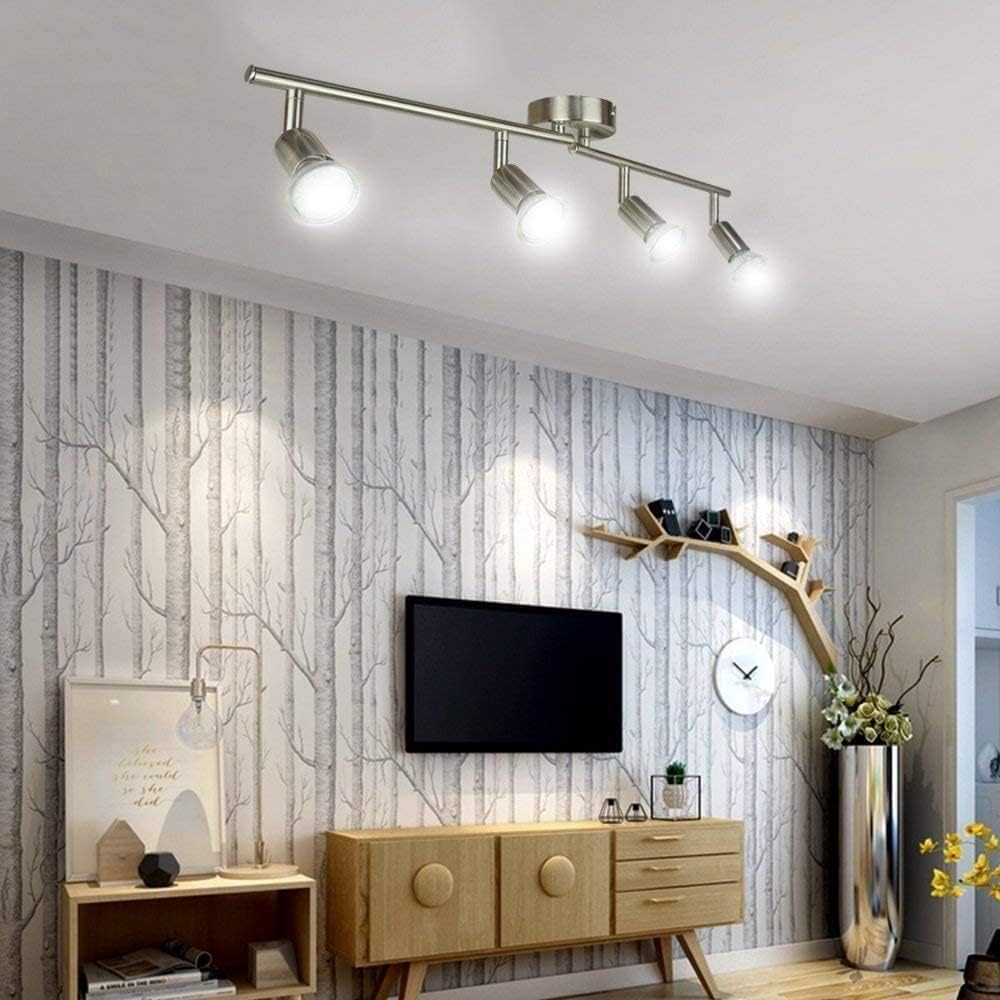 Chrome four head LED track lighting bar mounted on a ceiling