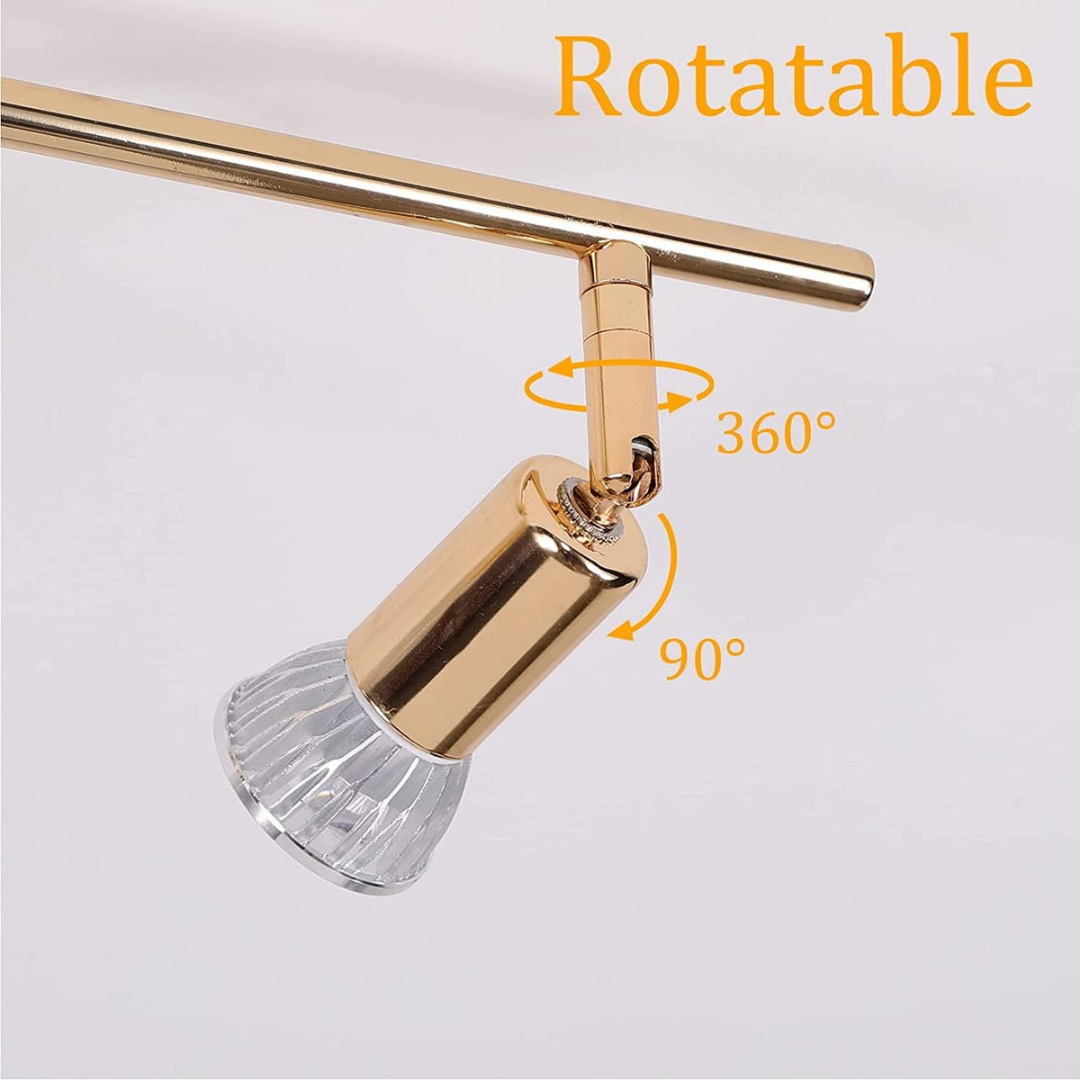 Gold four head LED track lighting bar mounted on a hallway ceiling