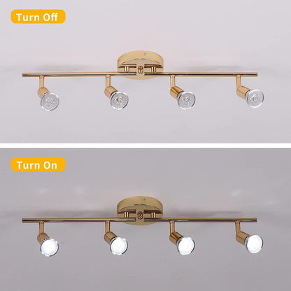 Gold four head LED track lighting bar mounted on a hallway ceiling