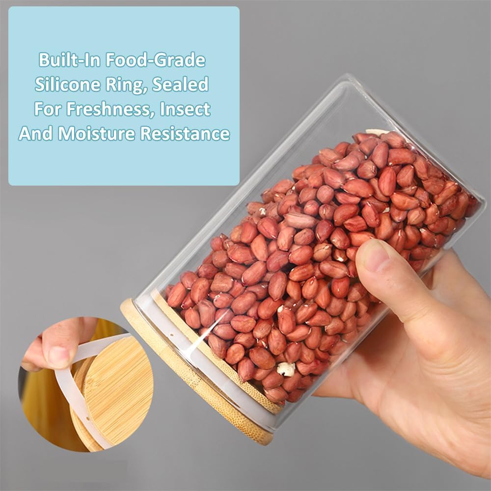 Twelve clear glass storage jars with bamboo lids in assorted sizes for pantry organisation