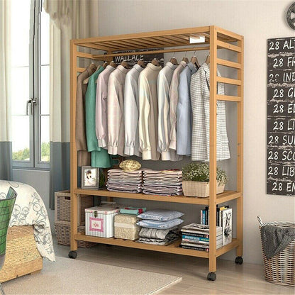 Three-tier bamboo clothes rack on wheels with side hooks and shelves