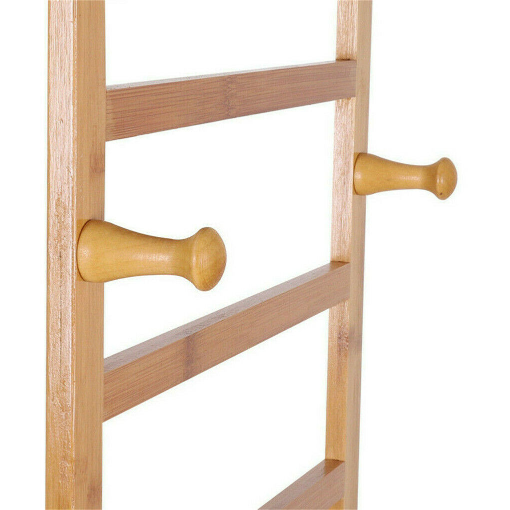 Three-tier bamboo clothes rack on wheels with side hooks and shelves