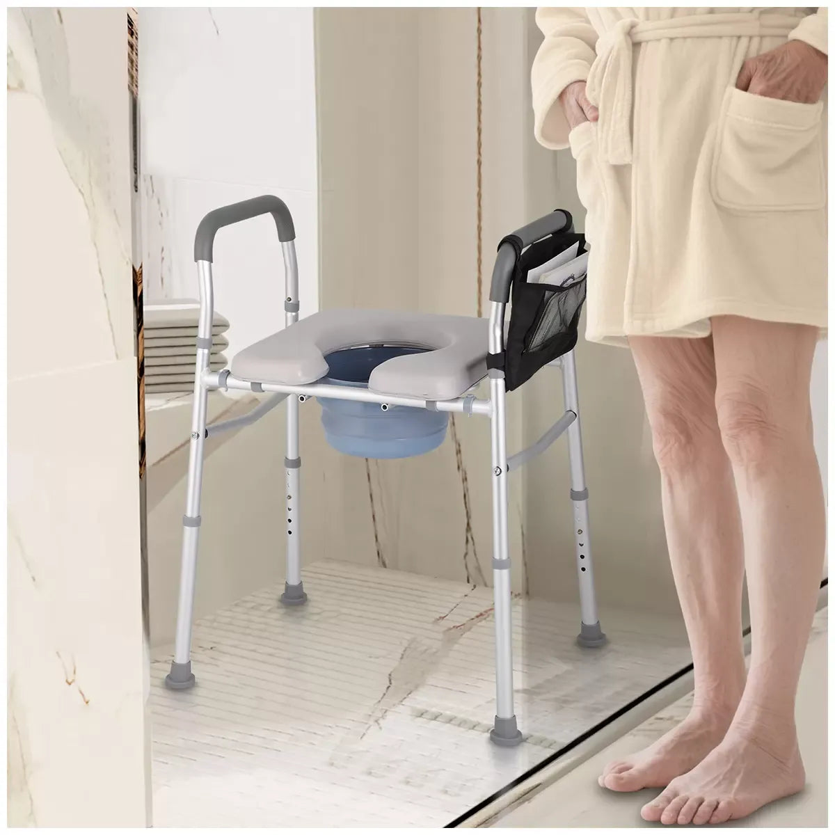 White heavy duty bedside commode chair with padded seat and armrests