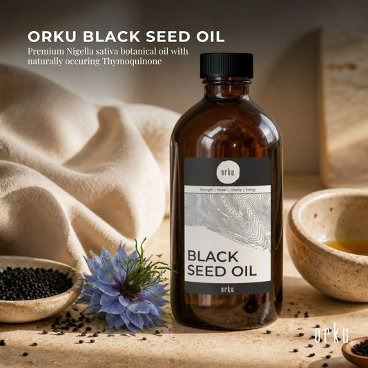 Amber bottle of Orku black seed oil shown standing upright