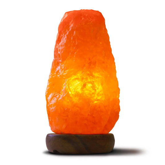 Natural pink Himalayan salt lamp on a wooden base with clear bulb