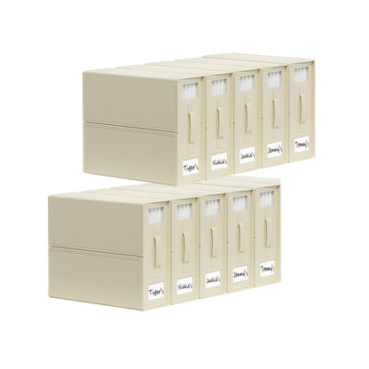 Beige foldable linen storage boxes with pull handles stacked in a wardrobe
