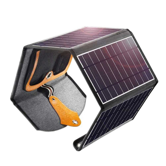 Foldable black solar panel charger with dual USB ports and carry holes