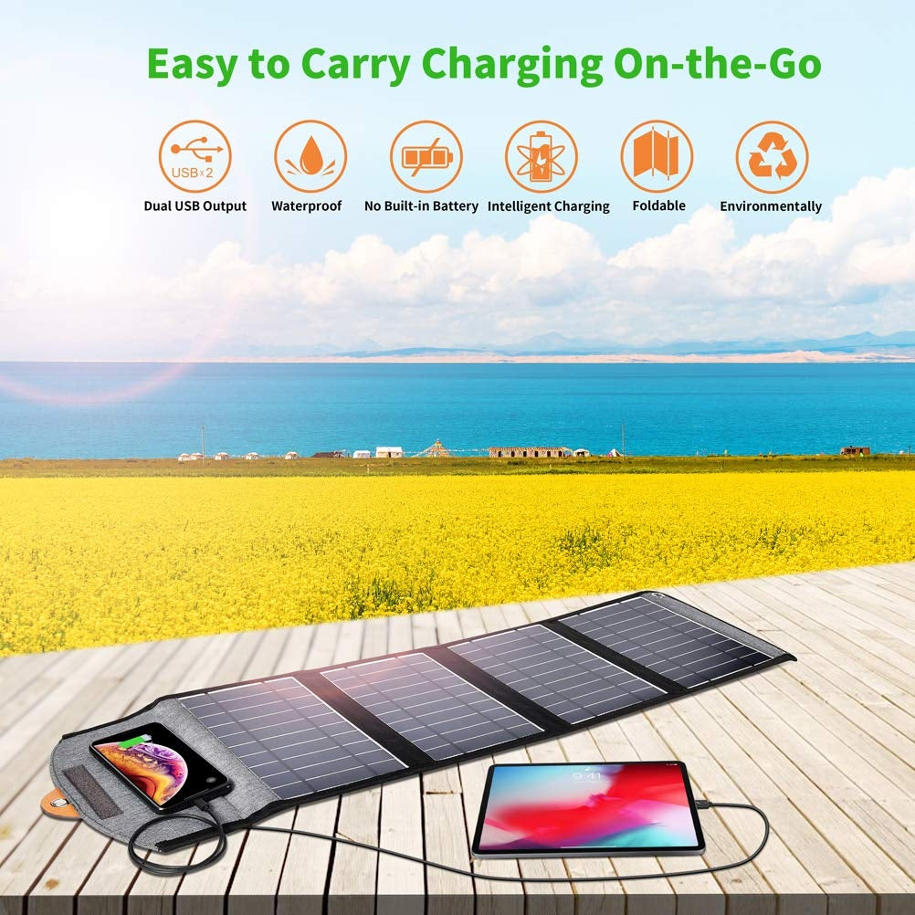 Foldable black solar panel charger with dual USB ports and carry holes
