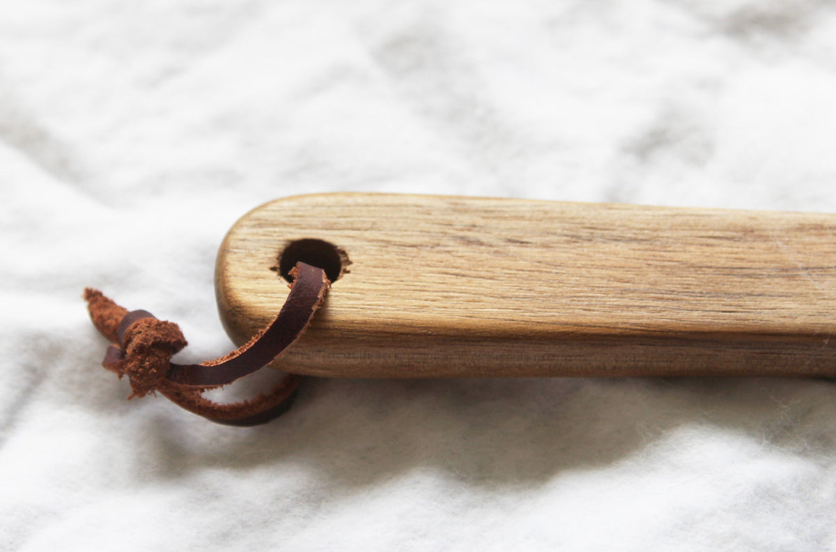Pack of wooden spoon bottle openers with leather hang straps