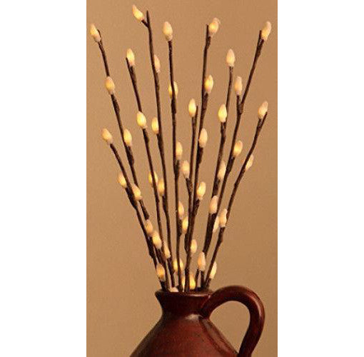 LED branch stems with warm white bulbs arranged as a table centrepiece