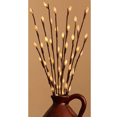 LED branch stems with warm white bulbs arranged as a table centrepiece