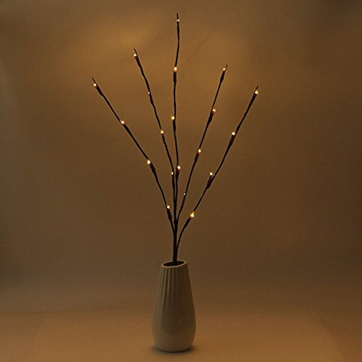 LED branch stems with warm white bulbs arranged as a table centrepiece