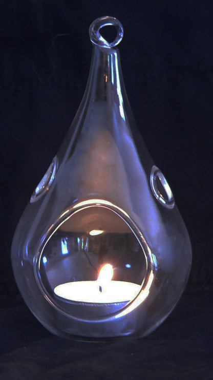 Clear glass teardrop tealight holders hanging at different heights