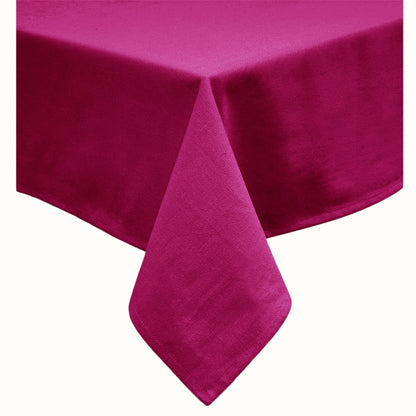 Fuchsia solid oblong table cloth laid flat on a dining table