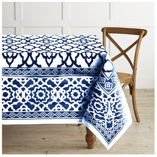 Indigo cotton tablecloth with a vintage printed border laid flat on a table