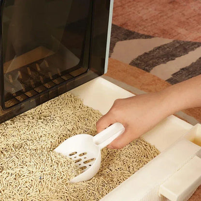 Green enclosed cat litter box with pull-out drawer tray and scoop