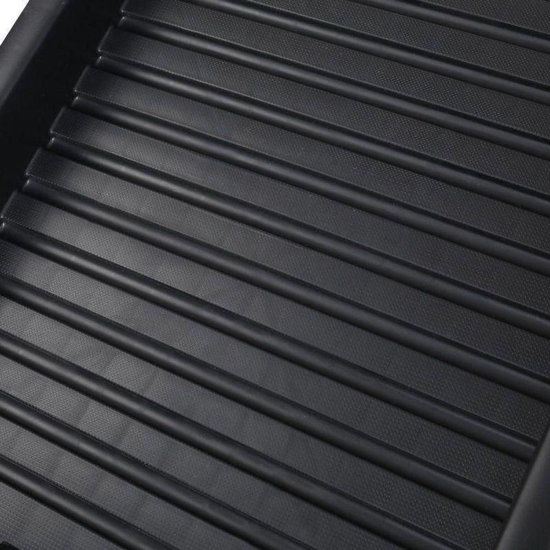 Folding pet ramp with ridged surface set against the back of an SUV