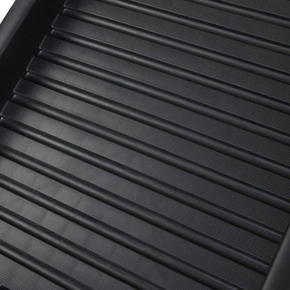 Folding pet ramp with ridged surface set against the back of an SUV