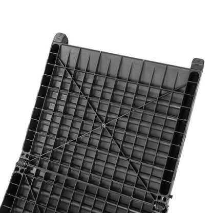Folding pet ramp with ridged surface set against the back of an SUV