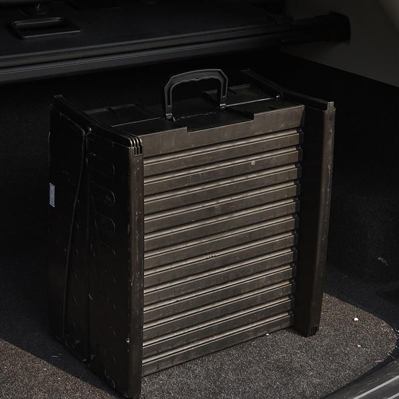 Folding pet ramp with ridged surface set against the back of an SUV