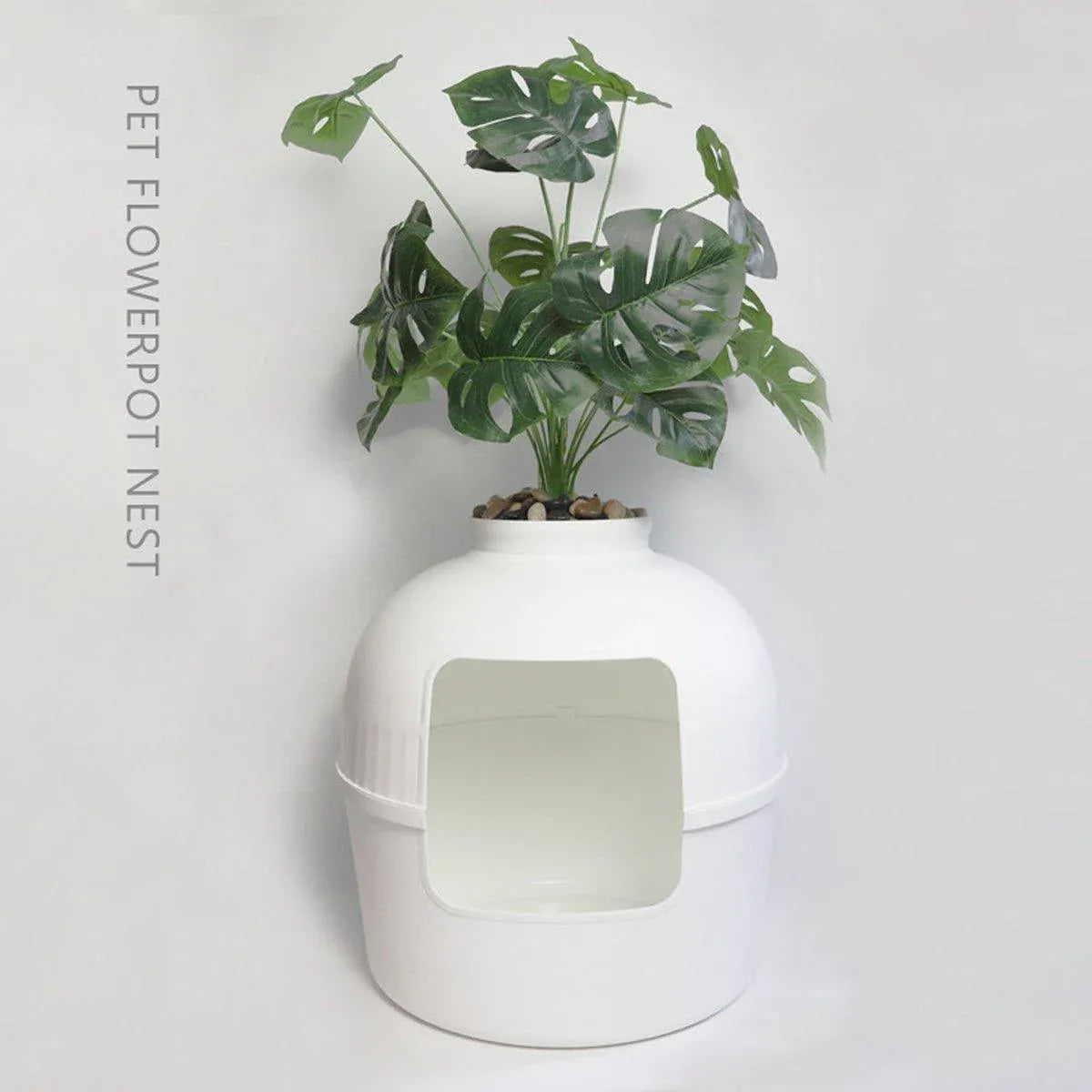 White plastic pet kennel with front opening and matching shovel