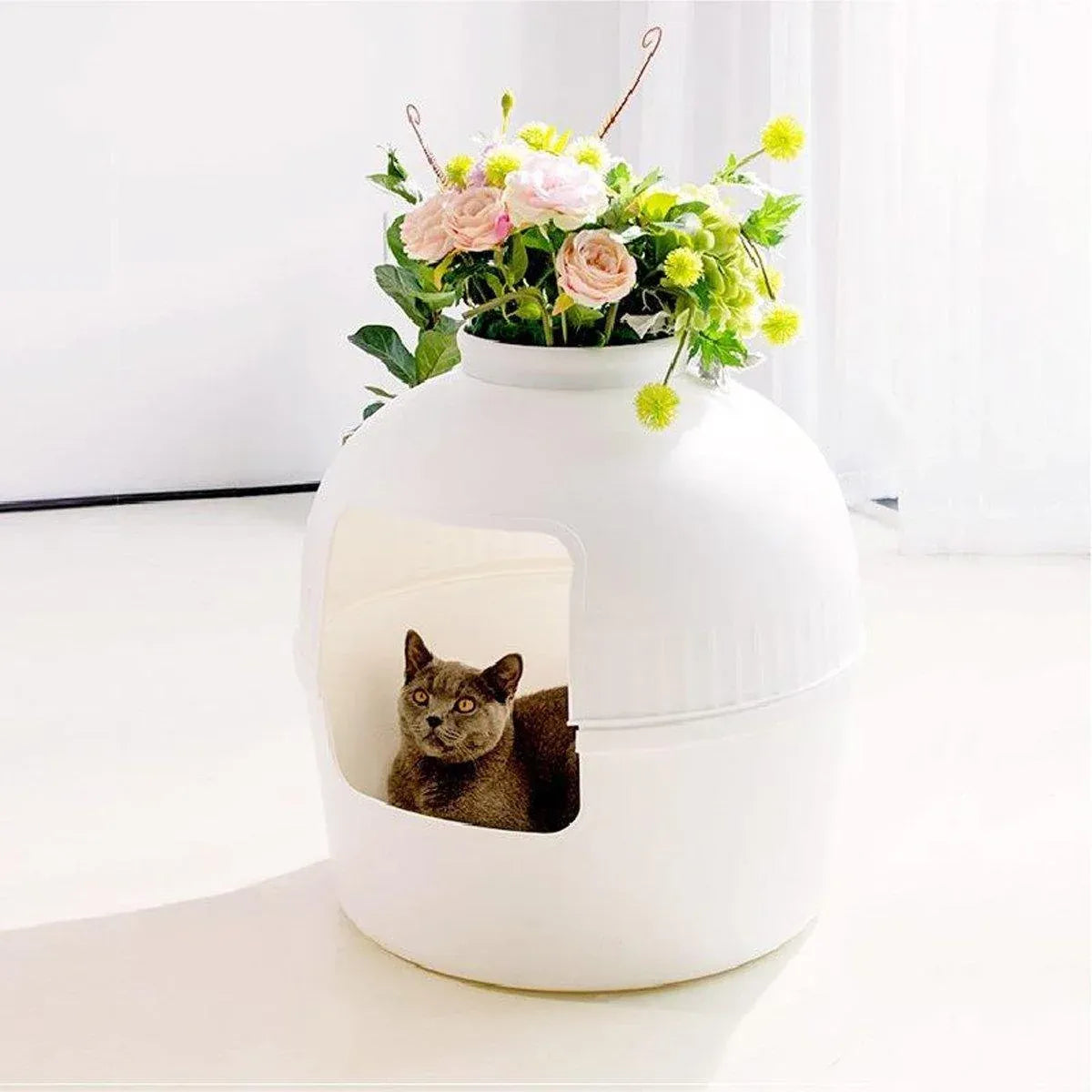 White plastic pet kennel with front opening and matching shovel