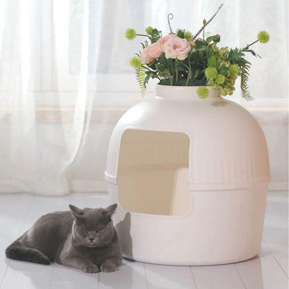White plastic pet kennel with front opening and matching shovel