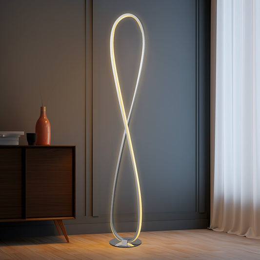 Slim chrome LED floor lamp standing in a living room corner
