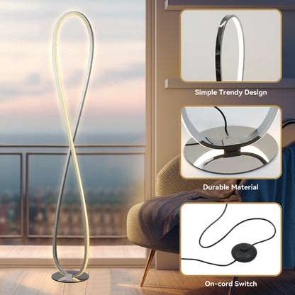 Slim chrome LED floor lamp standing in a living room corner
