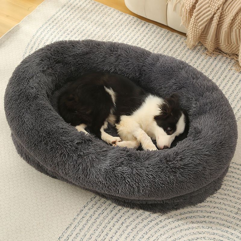 Dark grey fluffy donut pet bed with deep plush pile and raised rim
