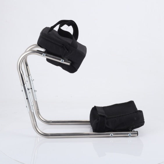 Folding garden kneeler with padded surface and steel handles on a lawn