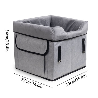Black portable dog booster seat with plush liner, safety straps and storage pockets