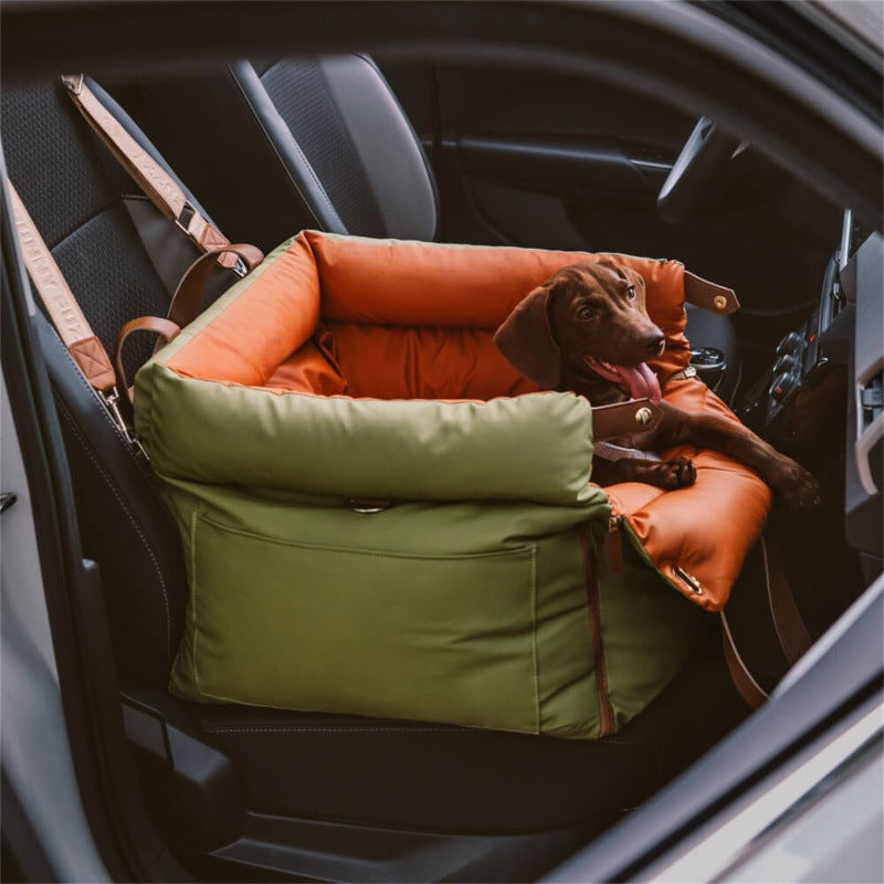 Green and orange plush pet booster car seat with non-slip base and side pocket