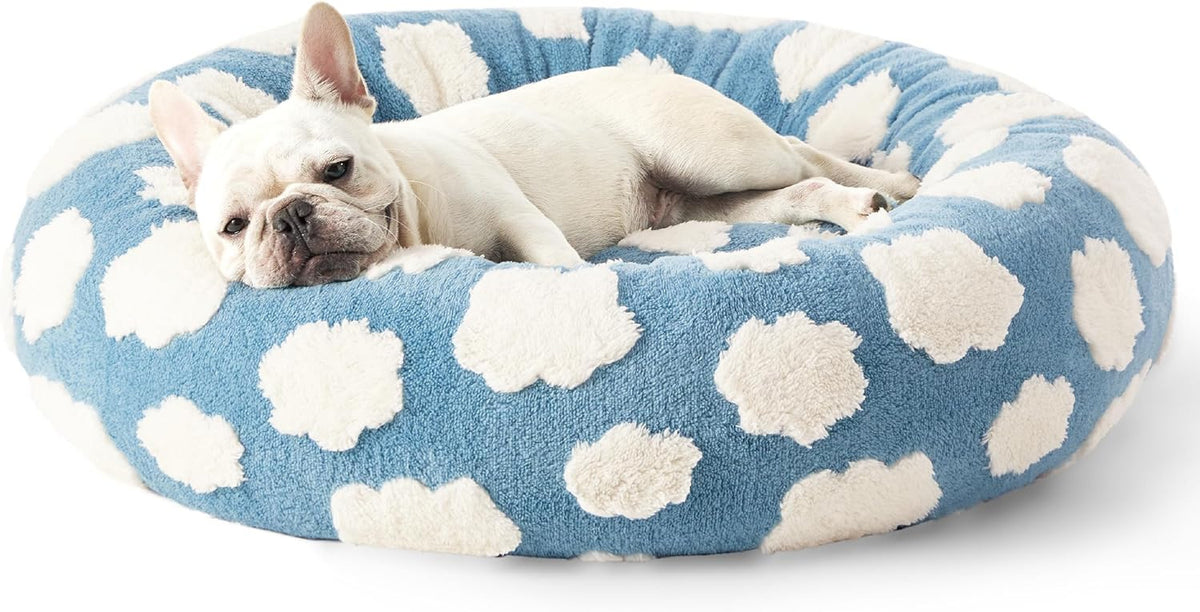Blue round plush pet bed with white cloud pattern and raised rim