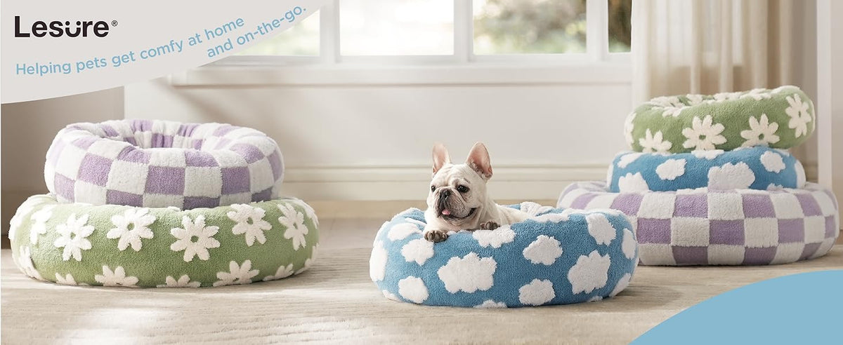 Blue round plush pet bed with white cloud pattern and raised rim
